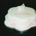 Petal Shape Christening Cake With A Cradle