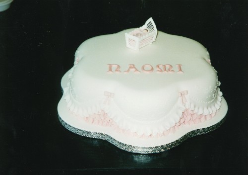 Petal Shape Christening Cake With A Cradle