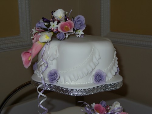 3 Tier Petal Wedding Cake With Calla Lilies Roses And Freesia