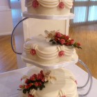 3 tier petal traditional style wedding cake with sugar flowers roses and orchids