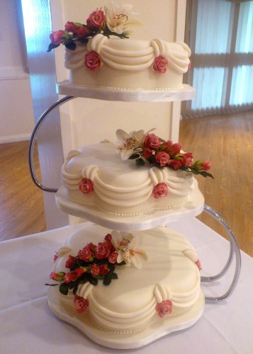 3 tier petal traditional style wedding cake with sugar flowers roses and orchids
