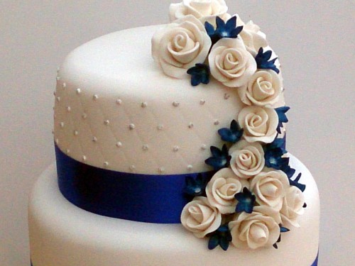 3 tier round stacked wedding cake sapphire blue and white sugar flowers