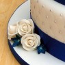 3 tier round stacked wedding cake sapphire blue and white sugar flowers thumbnail