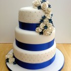 3 tier round stacked wedding cake sapphire blue and white sugar flowers