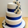 3 tier round stacked wedding cake sapphire blue and white sugar flowers thumbnail