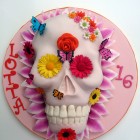 vibrant novelty skull cake with flowers and butterflies