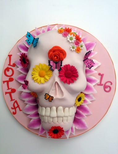 vibrant novelty skull cake with flowers and butterflies