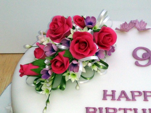 90th birthday cake with a sugar rose flower spray
