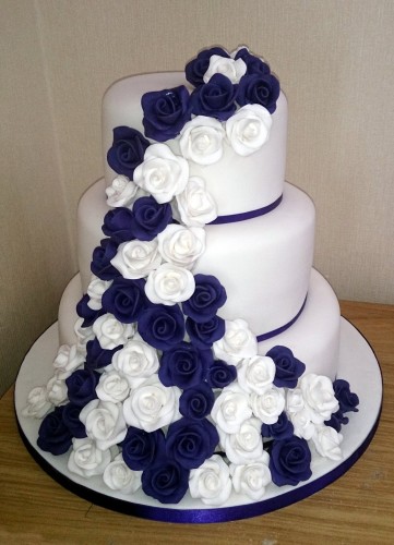 3 tier white and purple rose wedding cake