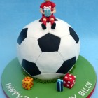 footballer sat on a football birthday cake