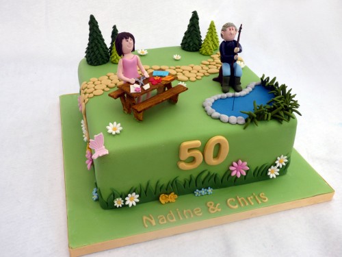 joint 50th birthday cake with a garden fishing and crafting theme