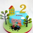 peppa pig and family themed birthday cake