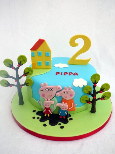 peppa pig and family themed birthday cake