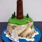 sailing around the lighthouse birthday cake