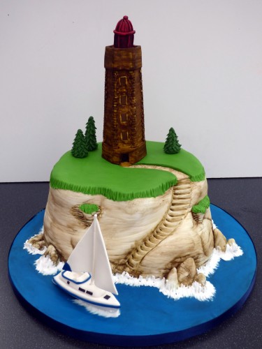 sailing around the lighthouse birthday cake