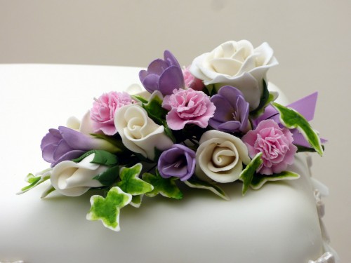 2 tier classic floral wedding cake with sugar flower spray