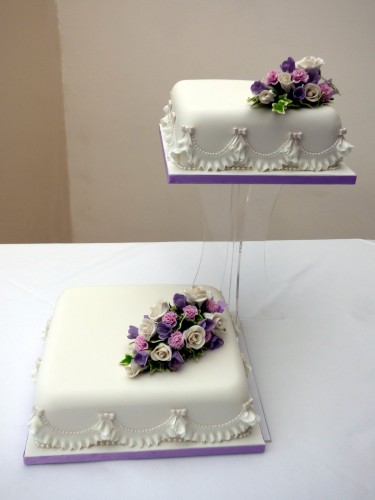 2 tier classic floral wedding cake with sugar flower spray