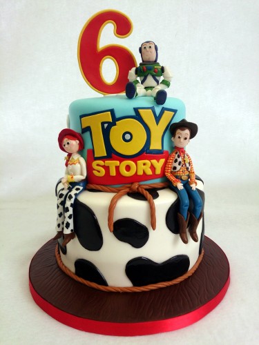 2 tier toy story cake with woody jessie and buzz lightyear