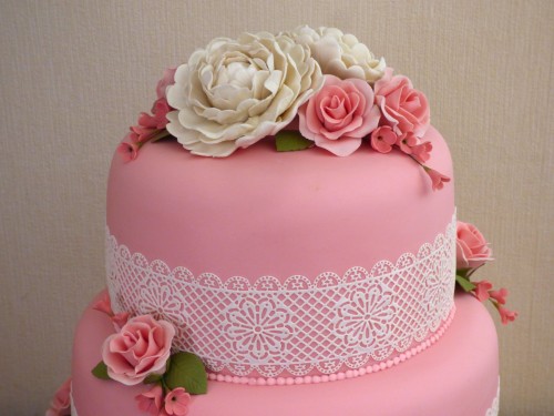 3 tier wedding cake with lace peonies and roses