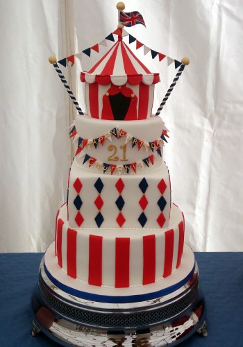 4 tier circus themed cake with big top
