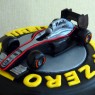 F1 pirelli tyre themed 3 tier wedding cake with bride and groom and F1Mclaren racing car thumbnail