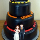 F1 pirelli tyre themed 3 tier wedding cake with bride and groom and F1Mclaren racing car