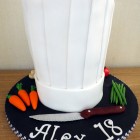 chefs hat birthday cake with fondant vegetables knife birthday cake