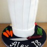 chefs hat birthday cake with fondant vegetables knife birthday cake thumbnail