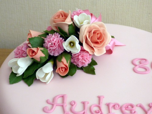 classic floral birthday cake with sugar flower spray