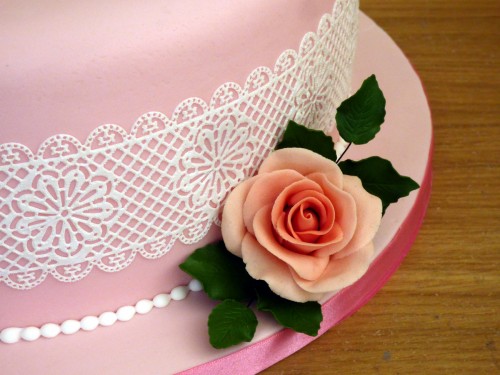 classic floral birthday cake with sugar flower spray