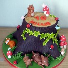 woodland themed birthday cake tree stump squirrel fox rabbit deer toadstool