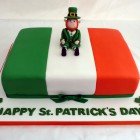 st patrick's day celebration cake with leprechaun topper