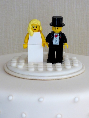 4-tier-ivory-wedding-cake-with-lego-figures-and-roses