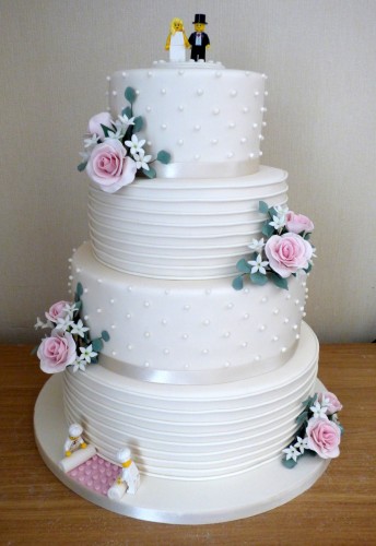 4-tier-ivory-wedding-cake-with-lego-figures-and-roses