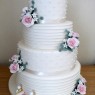 4-tier-ivory-wedding-cake-with-lego-figures-and-roses thumbnail