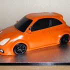 electric-orange-vauxhall-corsa-car-birthday-cake