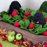 raised-strawberry-bed-with-dogs-and-produce-garden-birthday-cake thumbnail